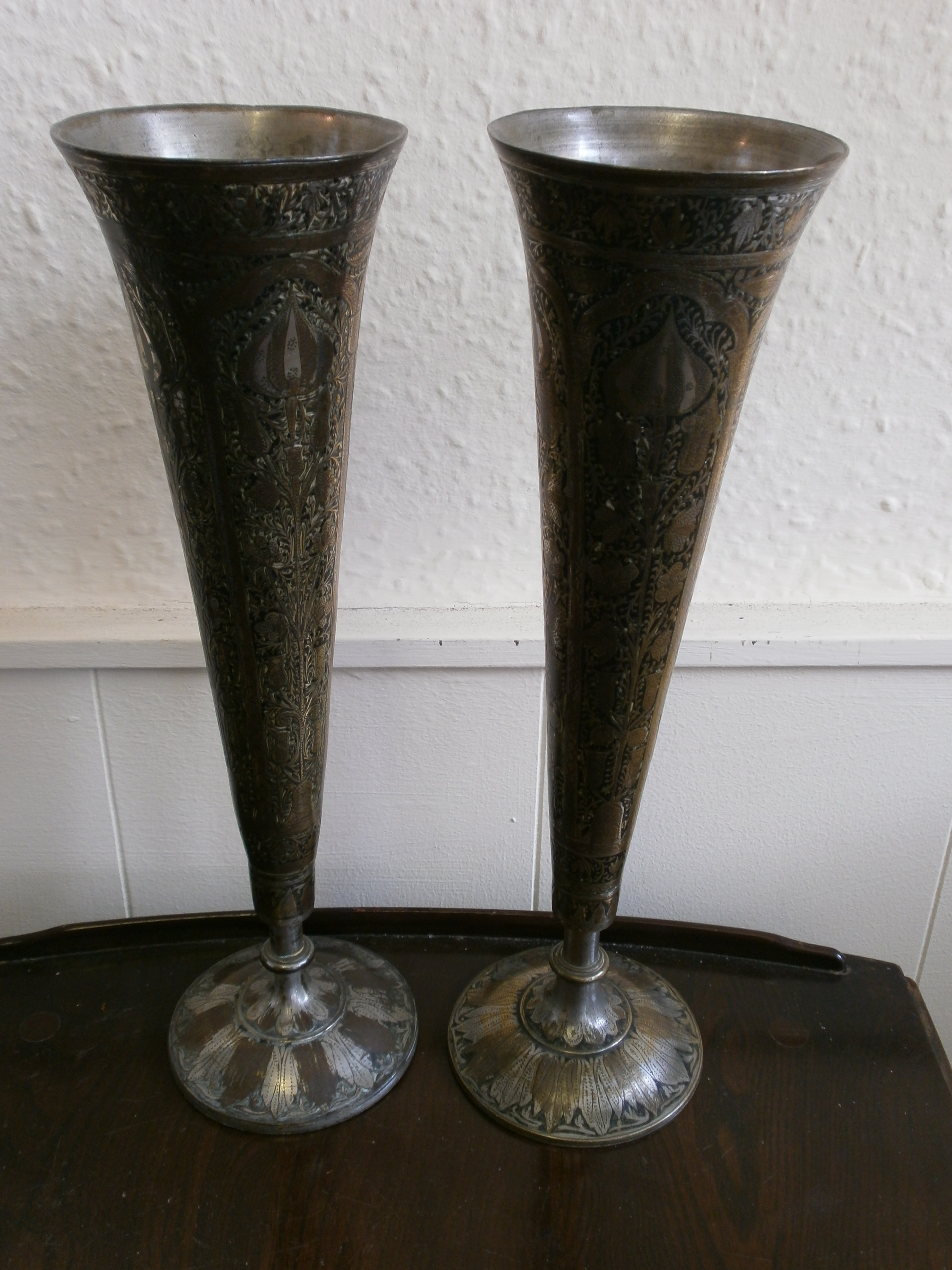 a pair of Asian engraved vases