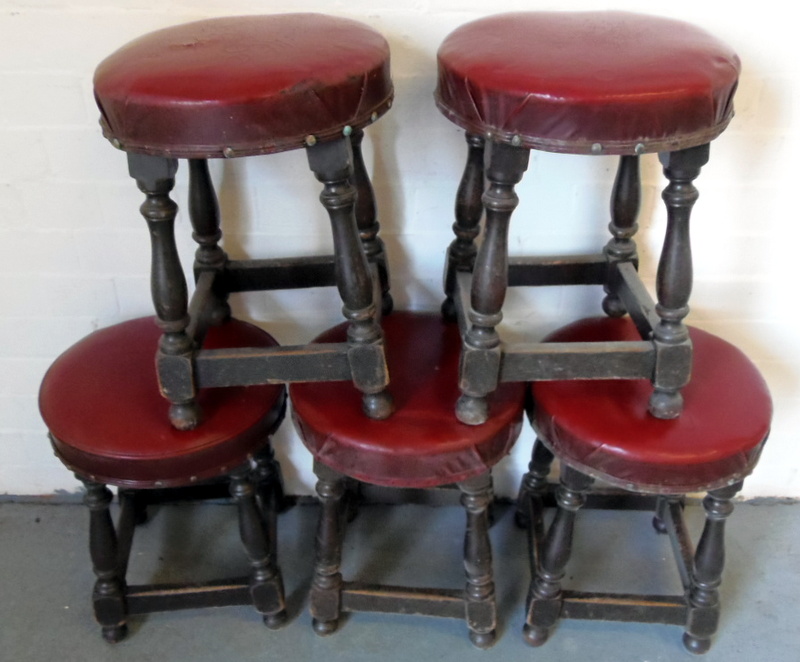 Five short wooden bar stools