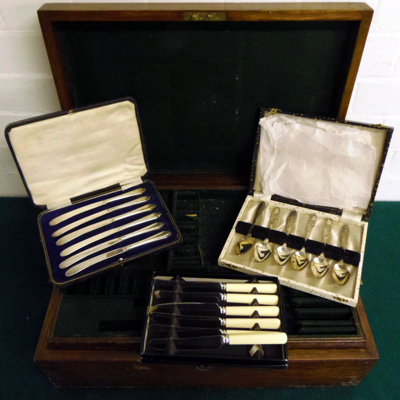 Oak three tier cutlery box and three sets of cutlery