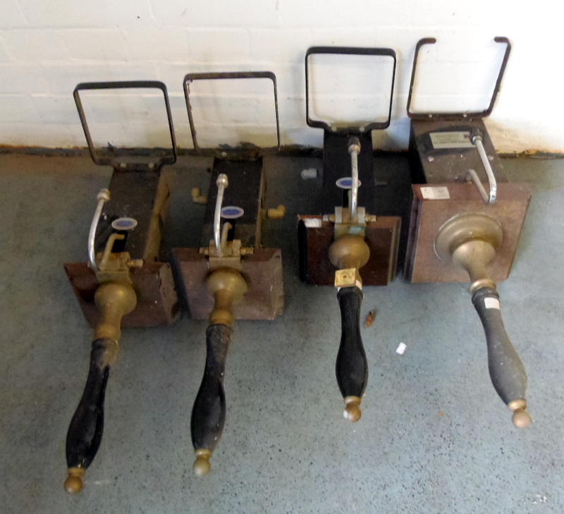 Four brass beer pumps