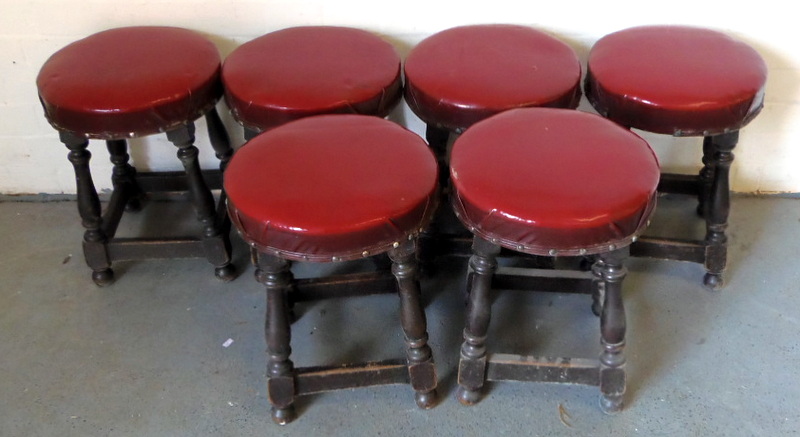 Six short wooden stools