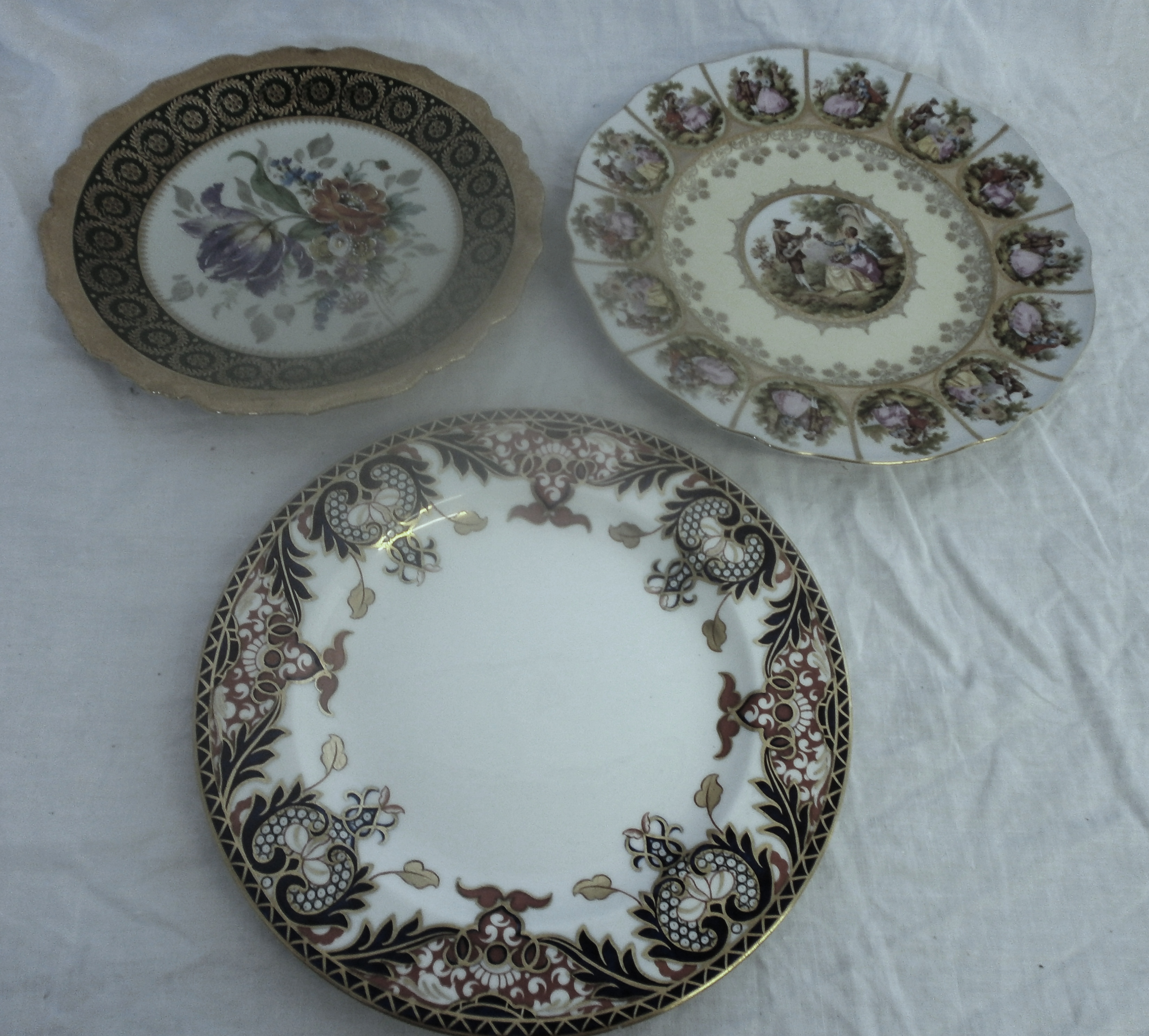 Three plates to include Royal Crown Derby