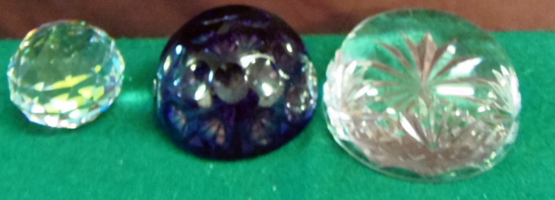 Three crystal glass paperweights