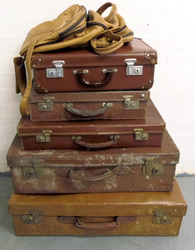 Five vintage suitcases and a bag