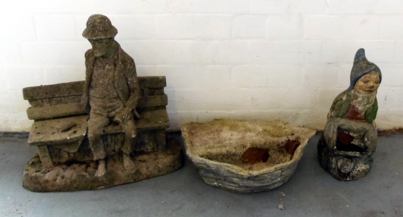 Two stone garden figures and a small planter