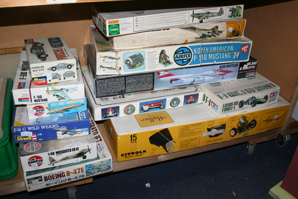 A collection of plastic model kits, including a Heller Citroën Avant, an Airfix P-510 Mustang, a