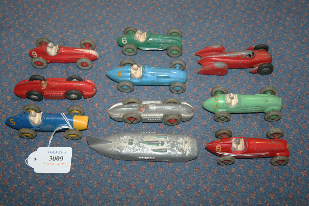 A small collection of Dinky Toys racing cars, including a No. 23H Ferrari, a No. 23J HWM and a No.