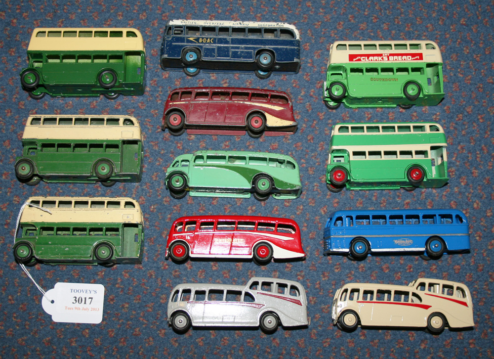 A small collection of Dinky Toys buses and coaches, comprising a No. 283 coach `BOAC`, two luxury