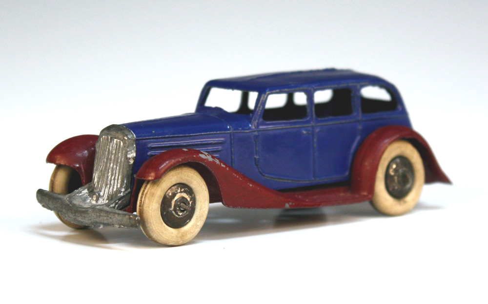 A Dinky Toys No. 30d Vauxhall with blue body, maroon chassis and white tyres (some playwear and