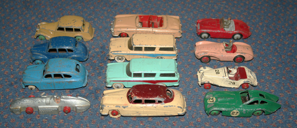 A small collection of Dinky Toys cars and sports cars, including a No. 132 Packard, an Aston