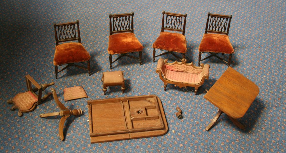 A small collection of 20th Century doll`s house furniture, comprising a Regency style dining