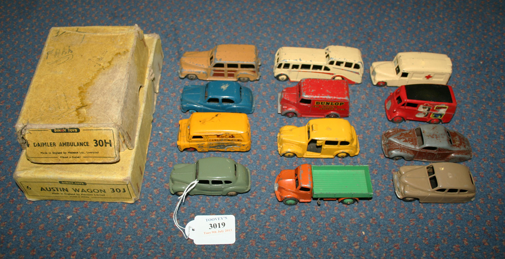 A small collection of Dinky Toys cars and commercial vehicles, including a No. 152 Austin Devon,