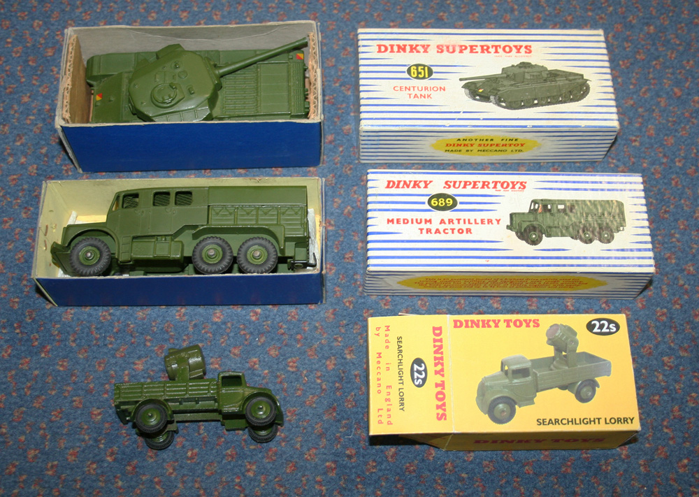 A Dinky Supertoys No. 651 Centurion tank and a No. 689 medium artillery tractor, both within blue