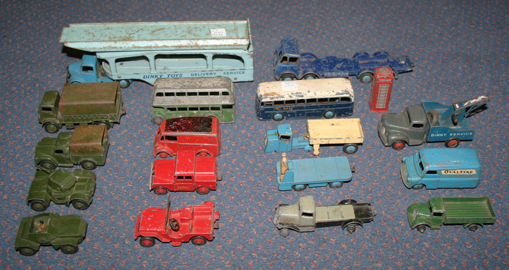 A small collection of Dinky Toys and Supertoys commercial and army vehicles, including a Pullmore