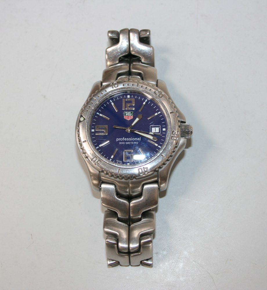 A Tag Heuer steel gentleman`s bracelet wristwatch, the signed blue dial with silvered Arabic and