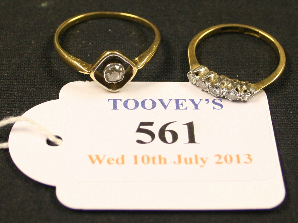 A gold, platinum and diamond set five stone ring, mounted with a row of circular cut diamonds