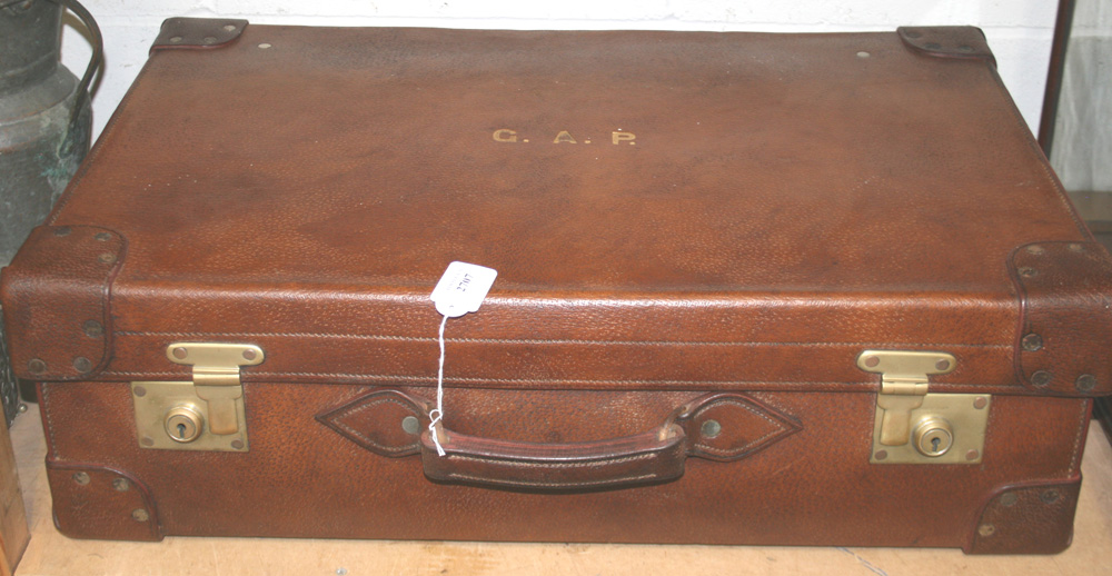 An early 20th Century brown leather travelling case, marked with gilt initials `G.A.P.`, length