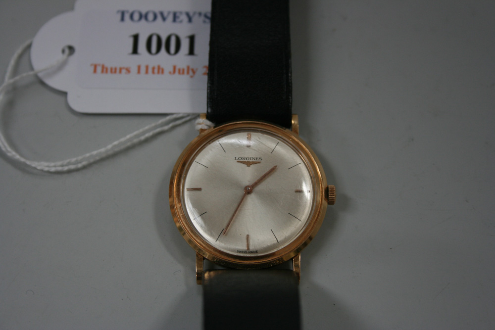 A Longines gold circular cased gentleman`s wristwatch, the signed circular silvered dial with gilt
