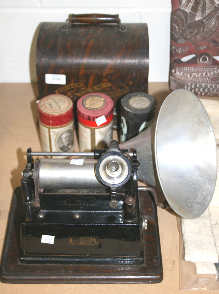 An Edison Gem phonograph with Model C reproducer, within an oak case, together with an aluminium
