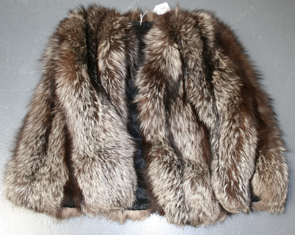 A brown fur cape, bearing label marked `Madame Louise Ltd Furrier Nairobi`, together with a fox