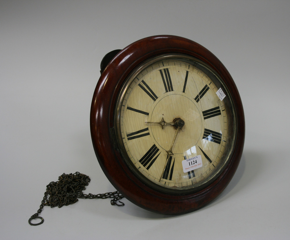 A 19th Century Continental mahogany circular wall clock with weight driven movement striking on a