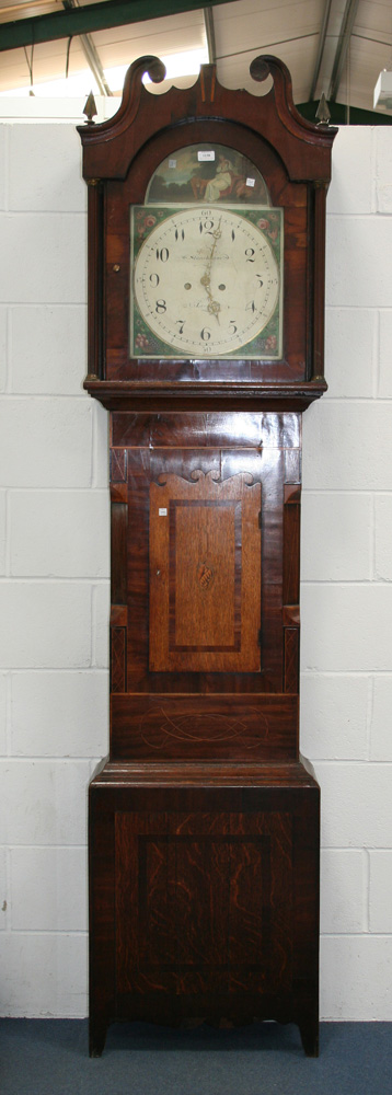 An early 19th Century oak and mahogany longcase clock with thirty hour movement striking on a