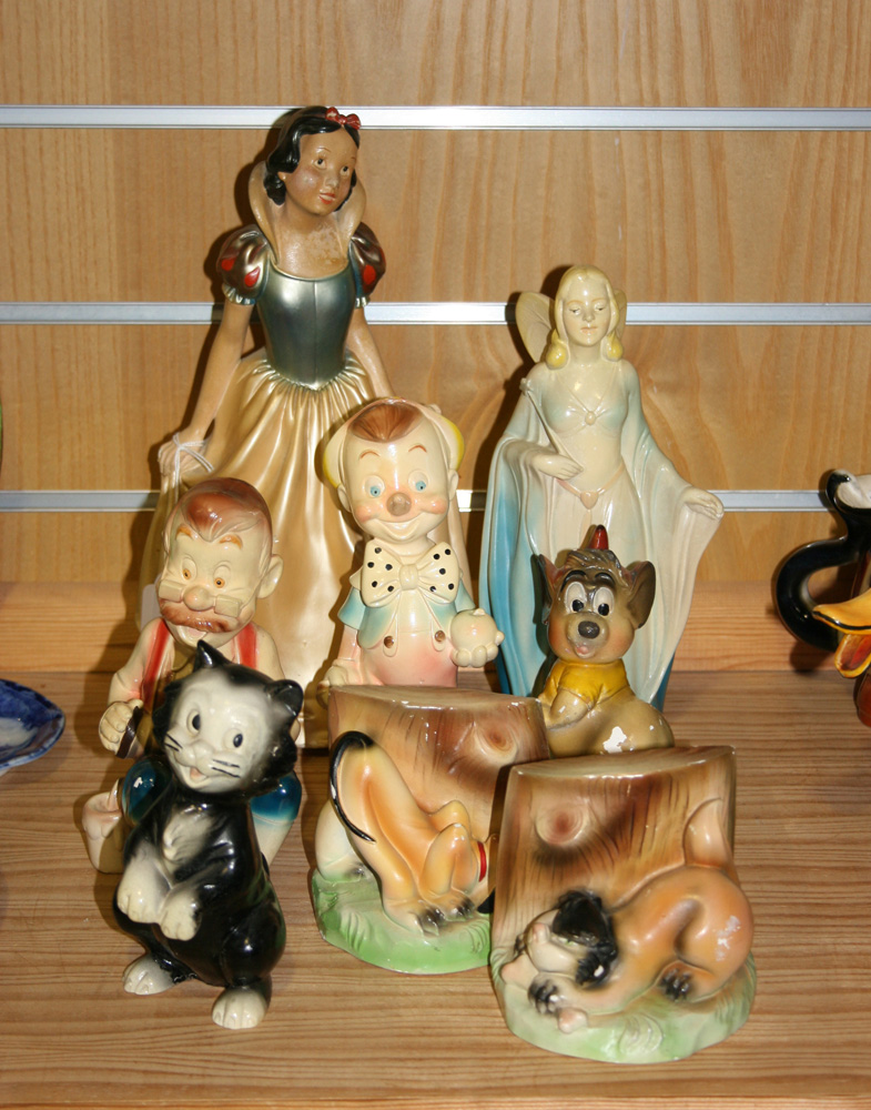 A collection of seven Leonardi Ltd Walt Disney plaster characters, including Snow White,