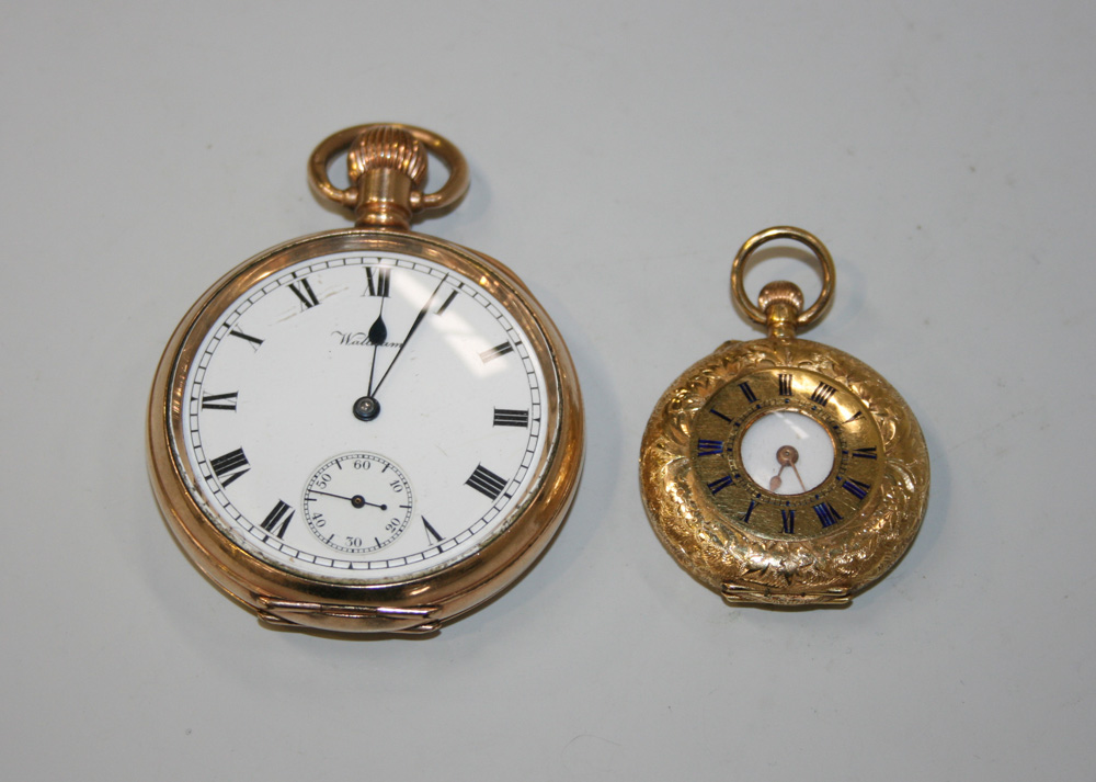 A gold keyless wind half hunting cased lady`s fob watch, the inner case detailed `J.B. Dent & Sons`,