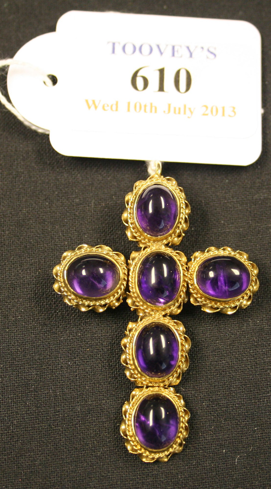 A 9ct gold and cabochon amethyst set pendant cross, mounted with six oval cabochon amethysts