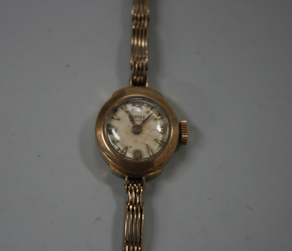 A Vertex Revue 9ct gold lady`s bracelet wristwatch, the signed circular dial with gilt Arabic and
