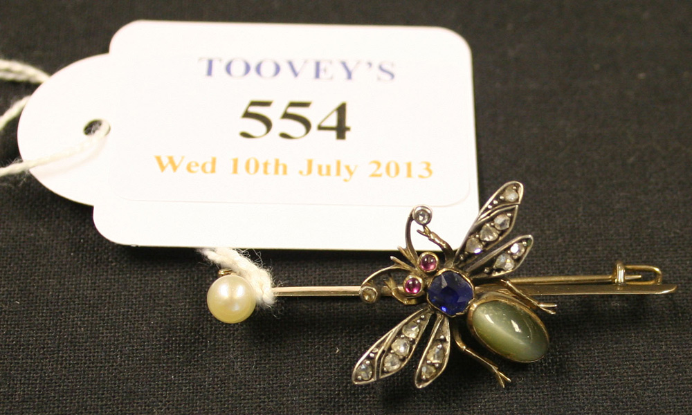 A rose diamond, sapphire, quartz cat`s eye and gem set bar brooch designed as a winged insect,