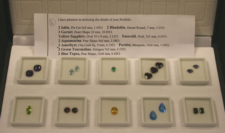 A collection of fifty-six variously cut coloured gem stones, including yellow sapphire, emerald,