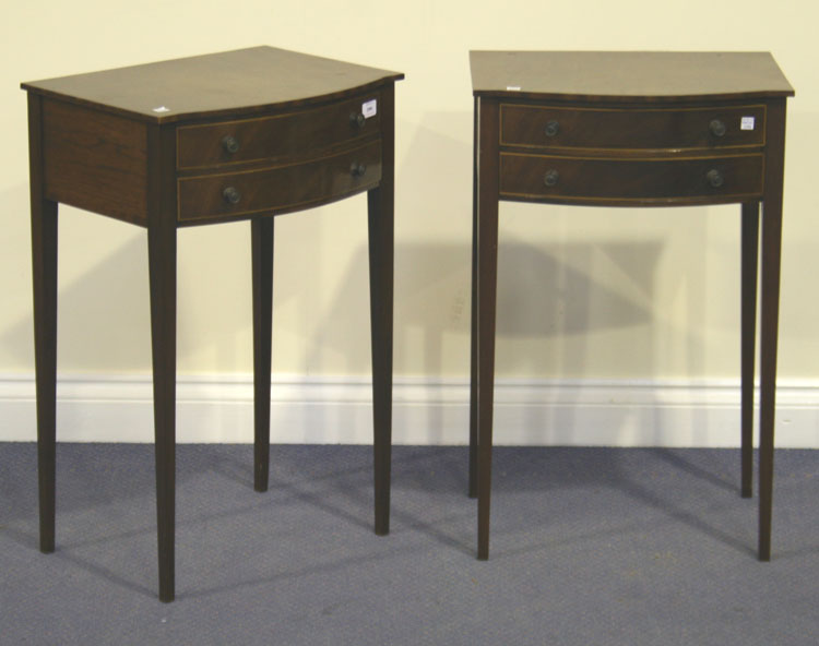 A pair of early 20th Century mahogany bowfront bedside tables, each fitted with two drawers, on