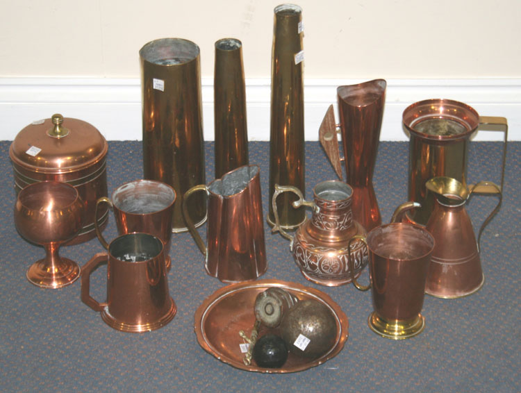 A collection of French copper kitchen ware, including a graduated set of pans, various oval pans,