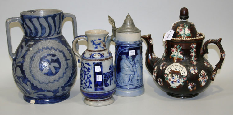 A Measham Bargeware teapot and cover, dated 1882, typically brown glazed and sprigged with flowers