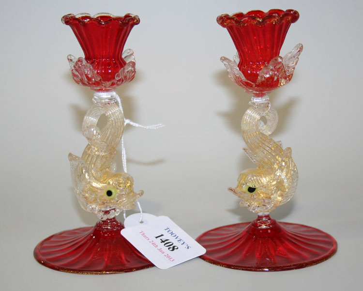 A pair of Venetian Murano glass dolphin stem candlesticks, probably early 20th Century, each with