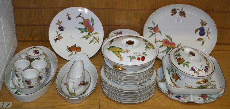 A Royal Worcester `Evesham` pattern part service, comprising eight dinner plates, seven soup plates,