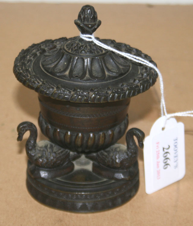 A Regency bronze censer, the pierced circular lid within an acanthus leaf rim, the reeded body on