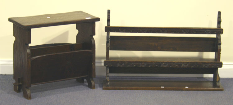 A 20th Century Jacobean Revival oak table, the rectangular top above a magazine rack, together