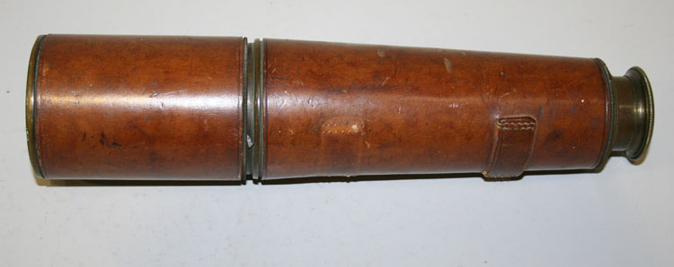 A First World War M.O.D. issue leather bound brass three drawer telescope, detailed T.T & H. Ltd,