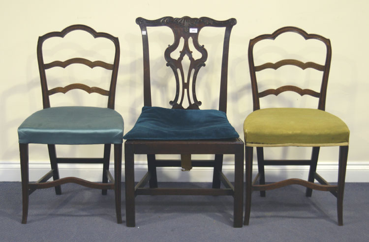 A George III mahogany pierced splat back dining chair and a pair of mahogany ladder back chairs.