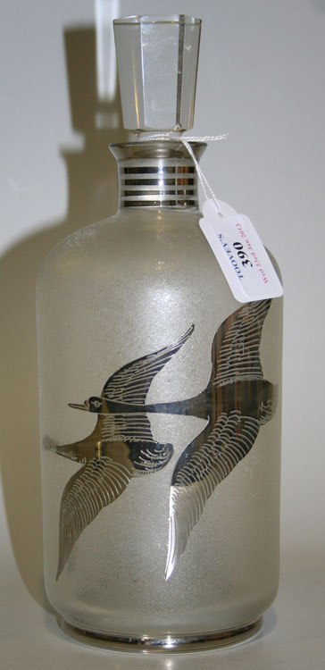 A 20th Century frosted glass and silver overlay decanter and stopper, the cylindrical body decorated