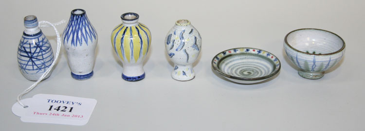Six pieces of miniature Rye pottery, each piece with white slip ground and polychrome geometric