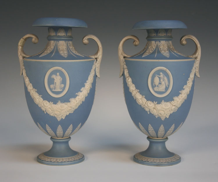 A pair of Wedgwood pale blue jasper dip two handled vases, 19th Century, the `U` shaped bodies