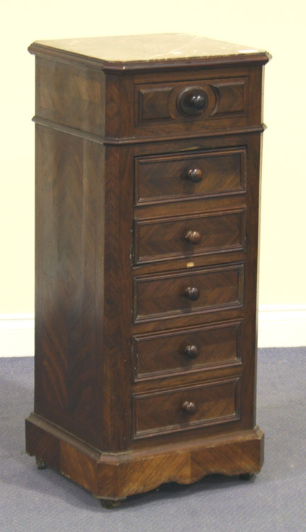 A 19th Century French rosewood bedside cabinet, the canted square top inset with rouge marble