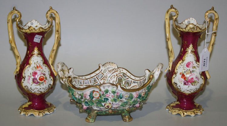A pair of English porcelain magenta ground vases, mid-19th Century, each baluster body painted