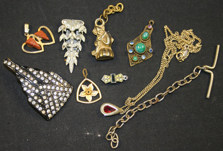 A collection of costume jewellery, comprising twenty-nine brooches, five necklaces, three bracelets,