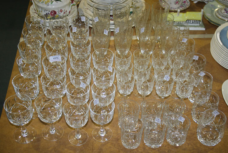 A part suite of glass cut with oval facets and crosses, comprising twelve large wines, eleven