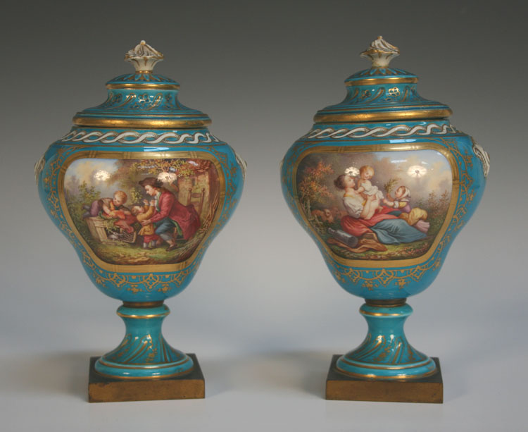 A pair of Sèvres style bleu céleste ground vases and covers, 19th Century, each ogee body finely