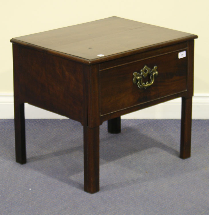 A George III mahogany converted commode stool, the moulded top above a single drawer, on block legs,